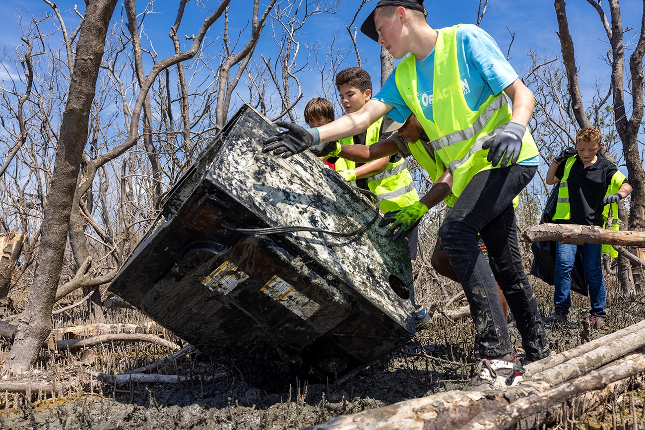 image of people removing large debris