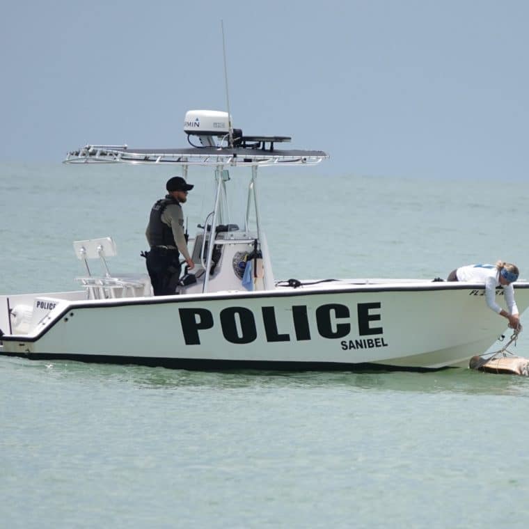 sea turtle stranding response with police boat