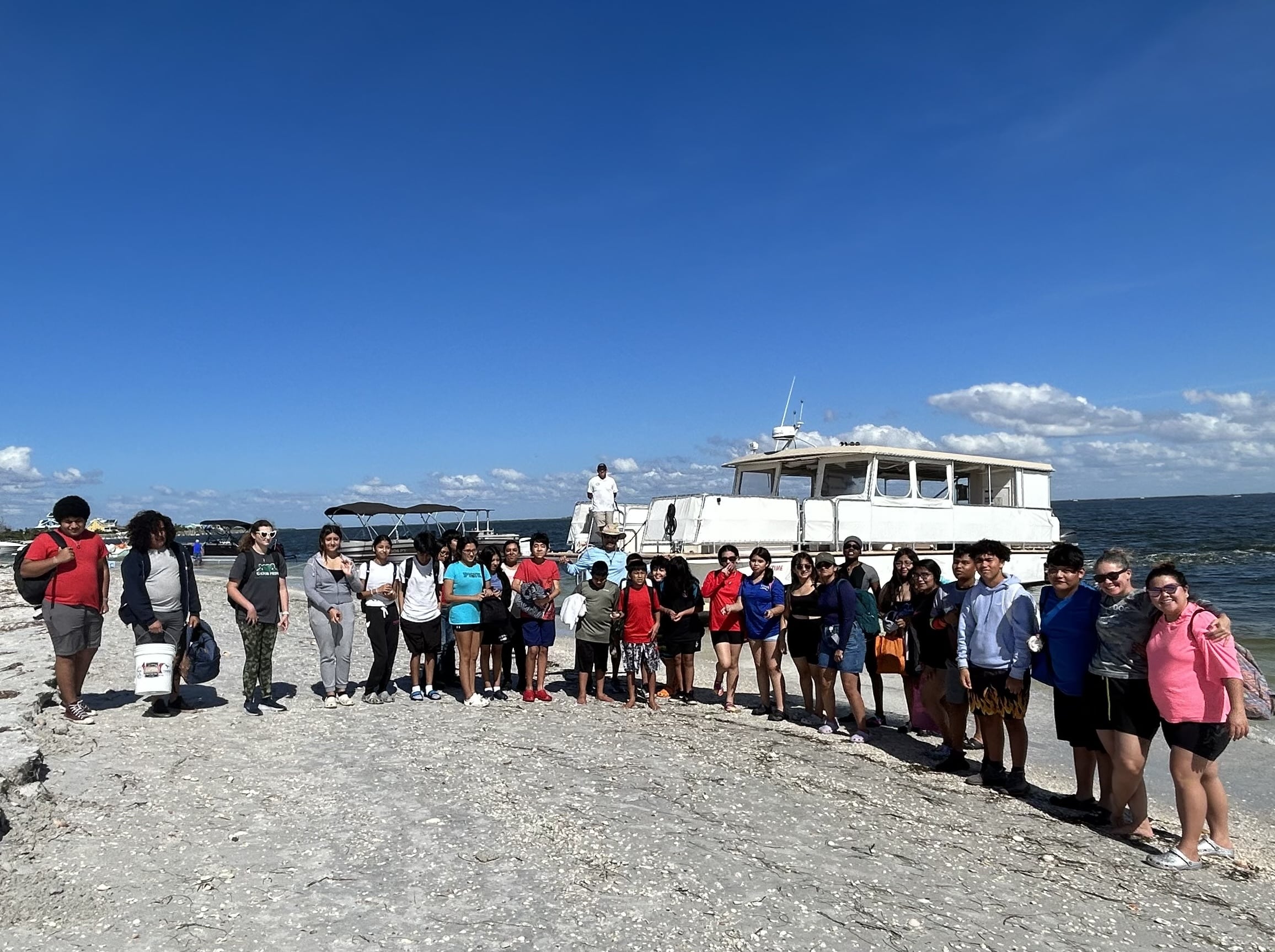 group of students on beach for no child left on shore field trip