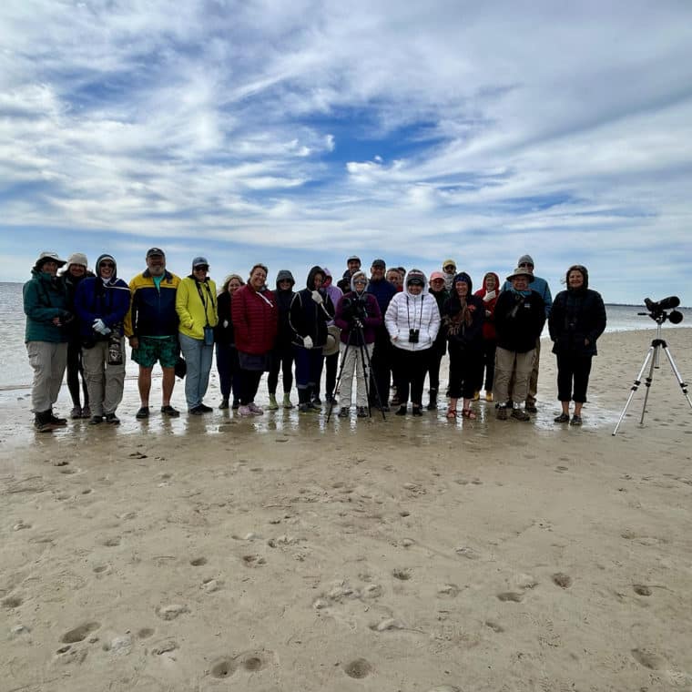group of 20-25 people on beach
