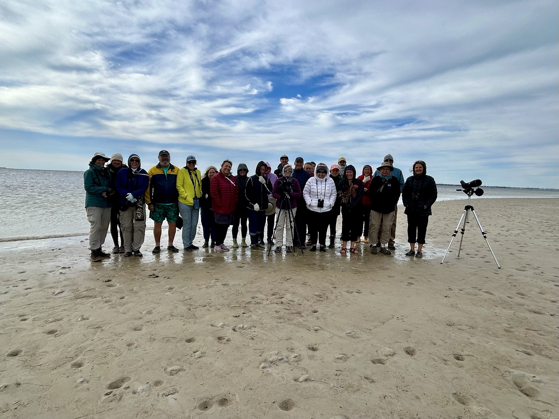 group of 20-25 people on beach