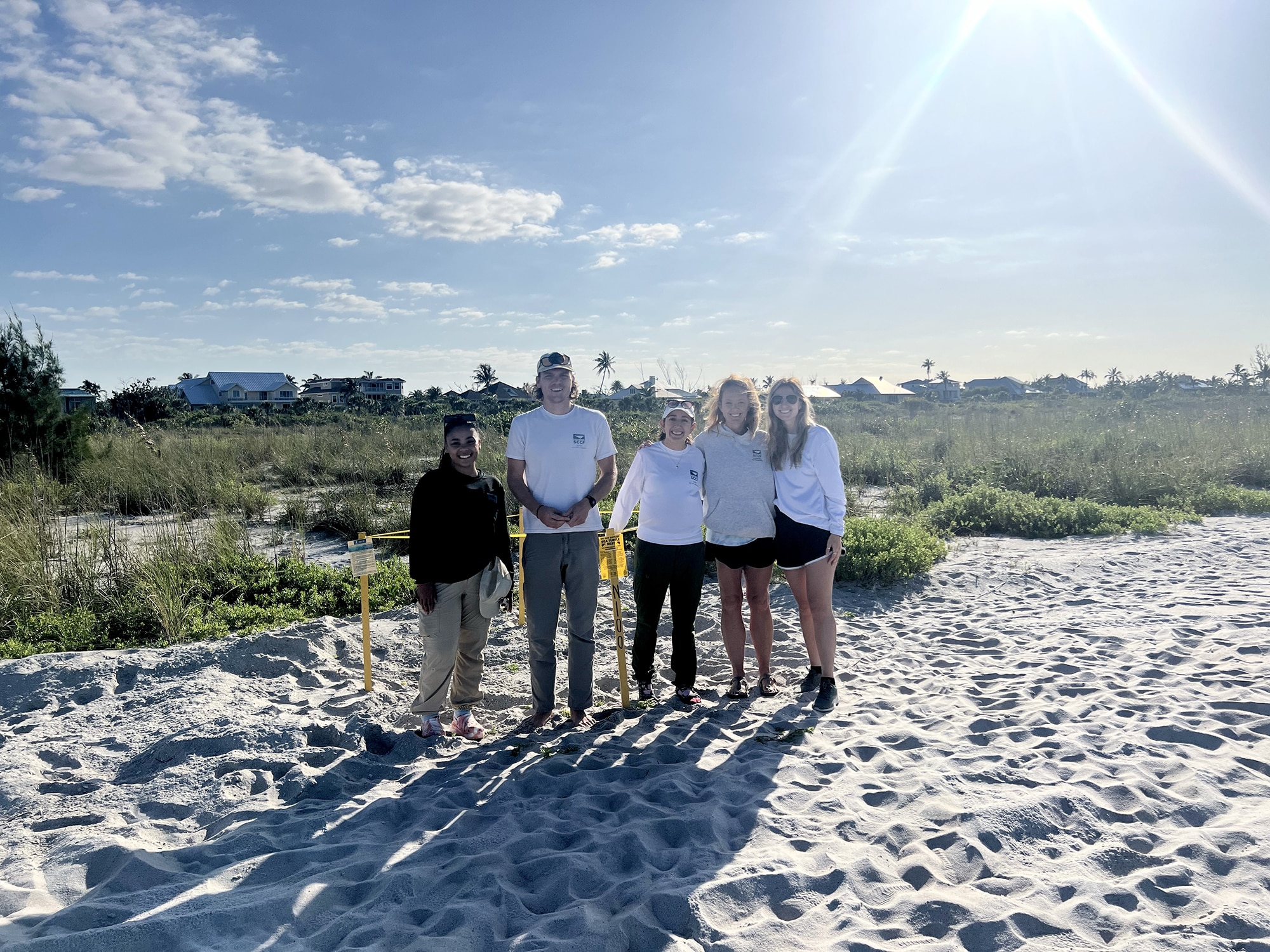 image of people next to sea turtle leatherback nest on sanibel