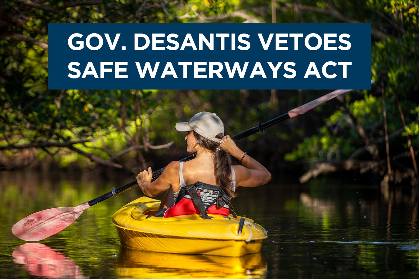 image of woman kayaking with text 'gov DeSantis vetoes safe waterways act'