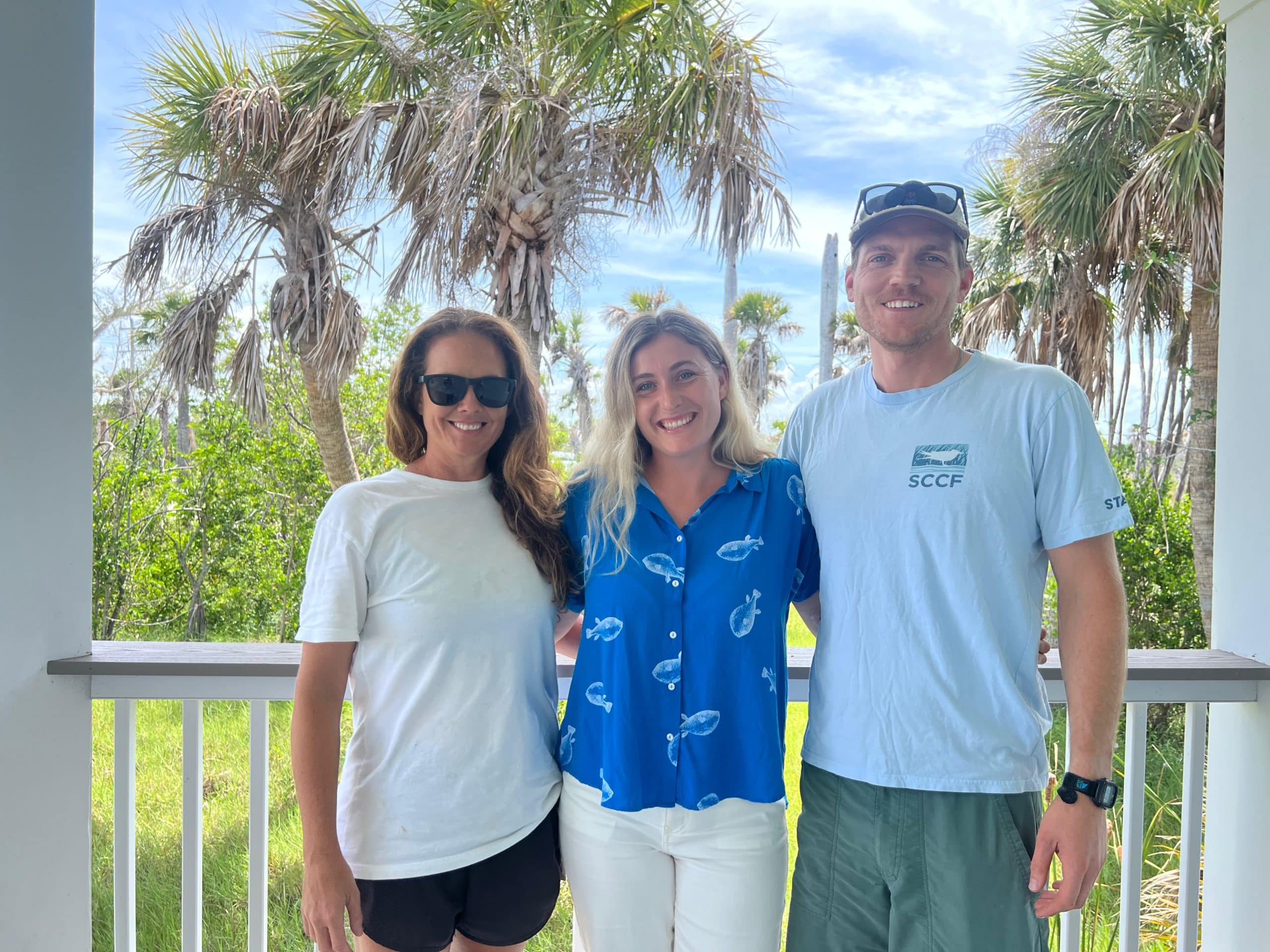image of three people smiling outdoors