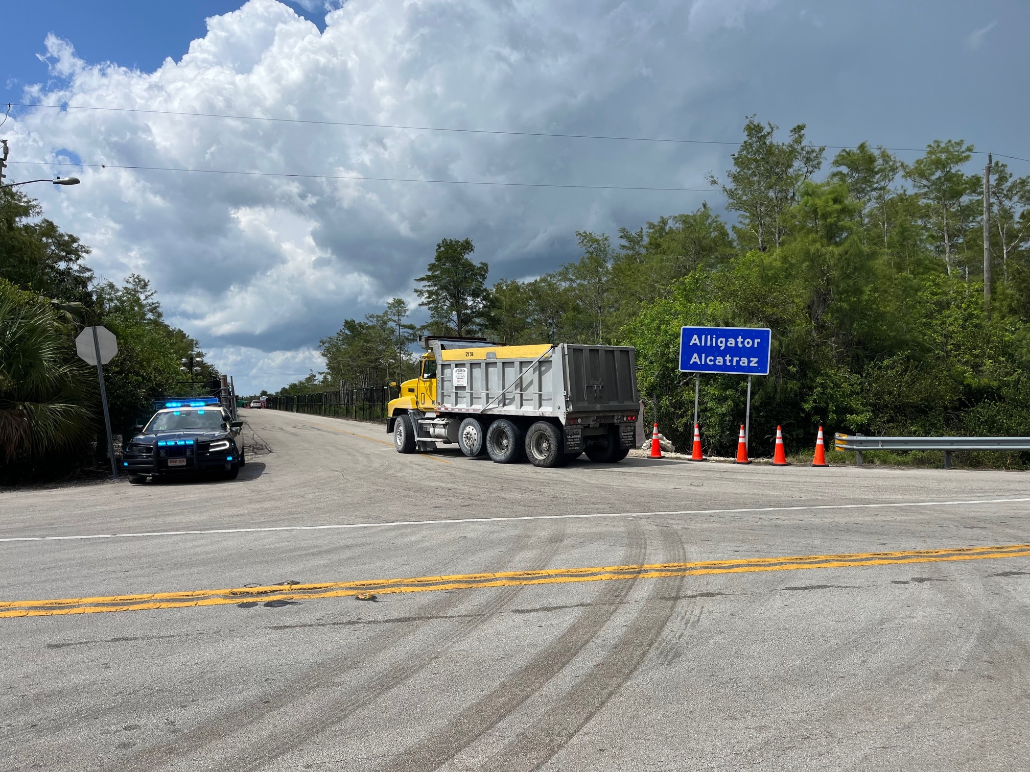 alligator Alcatraz sign and police car
