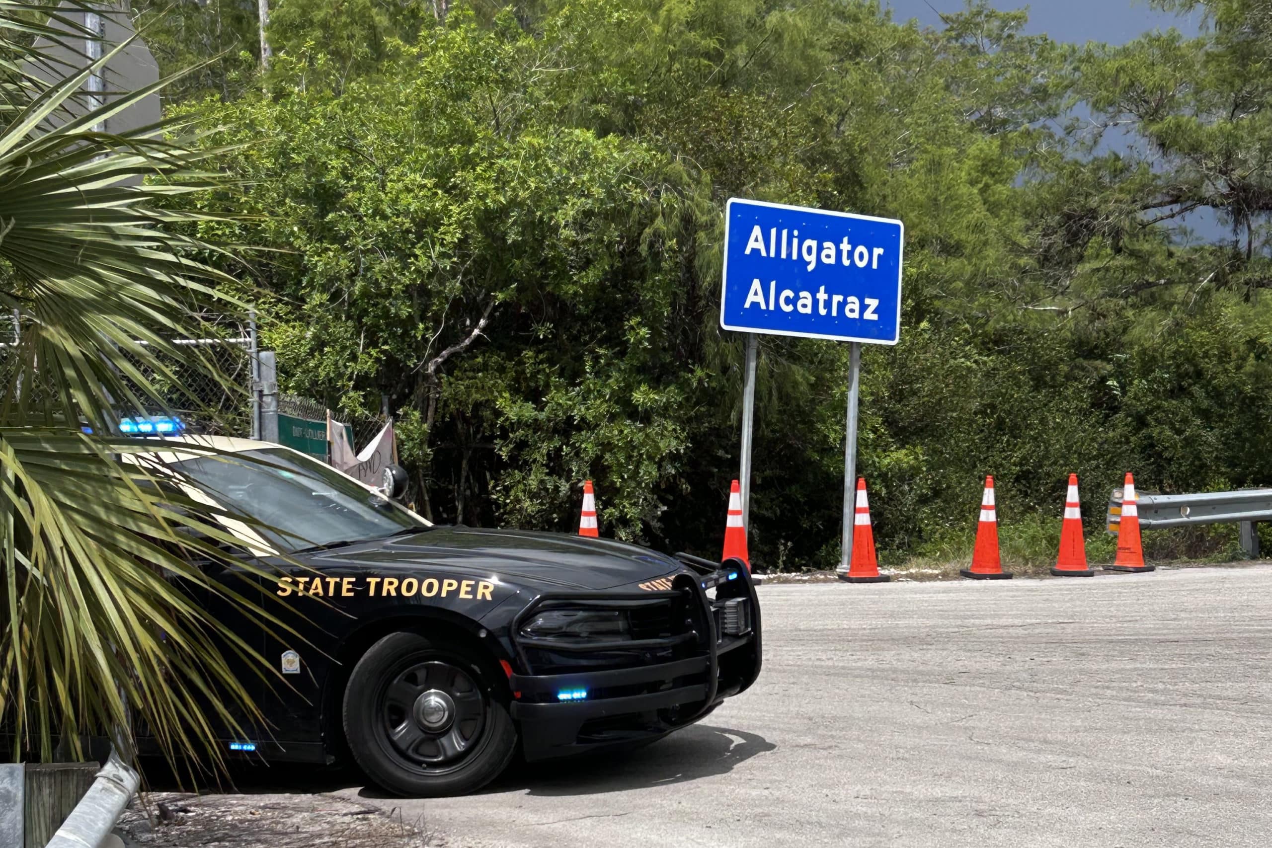 Alligator Alcatraz Sign And Trooper Car
