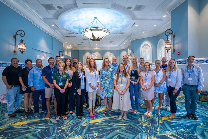 group of 2025 preserving paradise participants stand for indoor photo