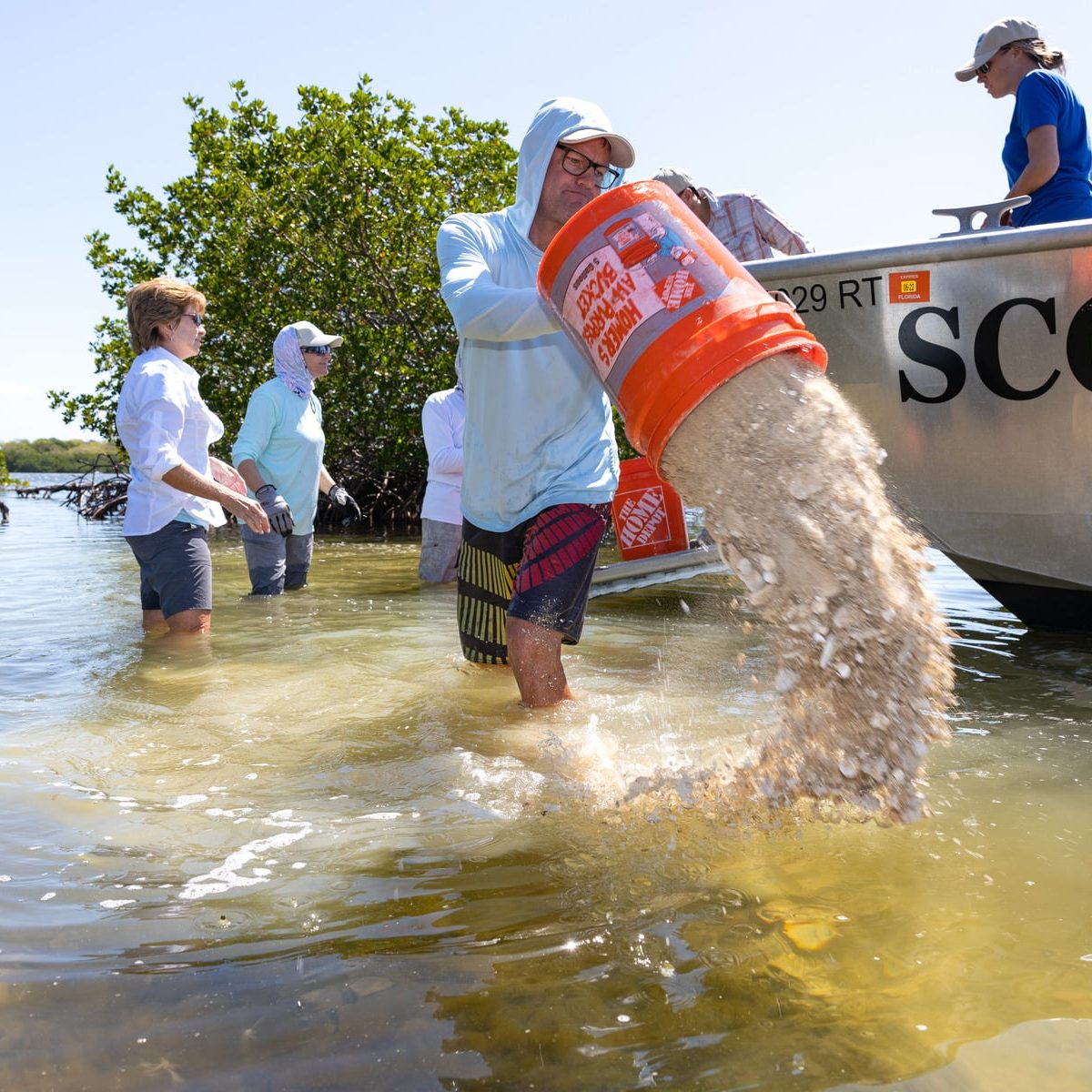 Oyster Restoration Eric Throwing 1800